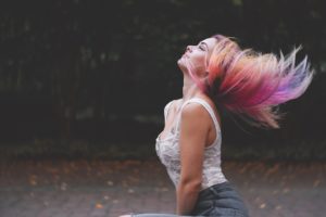 woman swinging hair with multiple colors