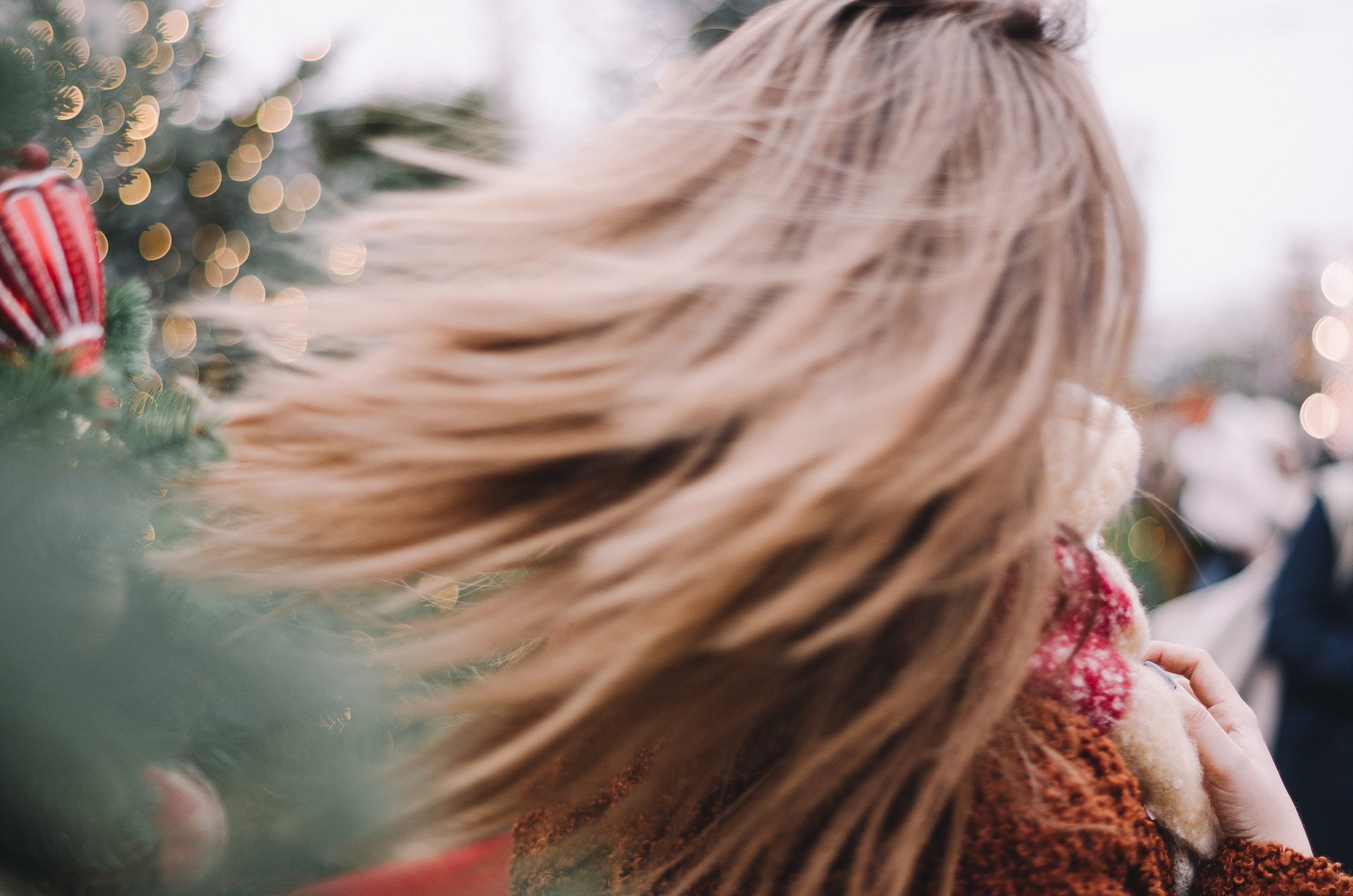 woman with hair swinging in christmas