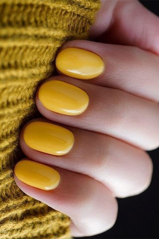 yellow nail polish manicure with nail art
