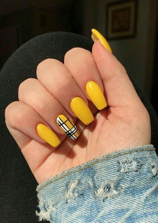 yellow finger nail polish with plaid nail art