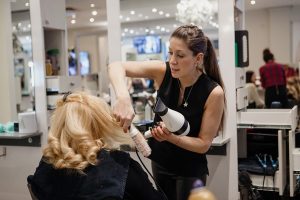 top hairstylist in action at salon deauville
