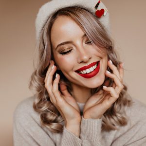 woman with christmas hat smiling