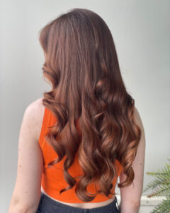 image of back of woman's head with pretty auburn hair