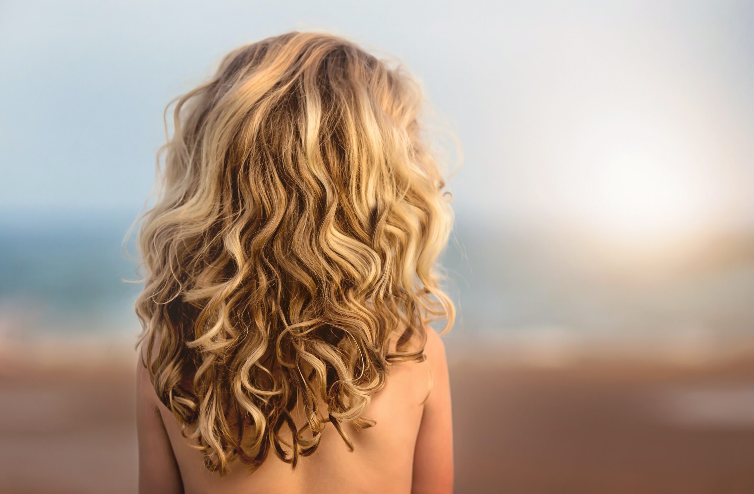 woman with handpainted balyage blonde